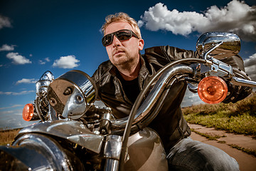 Image showing Biker on a motorcycle