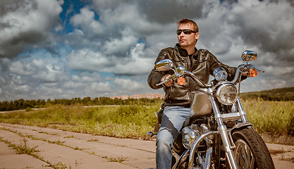 Image showing Biker on a motorcycle