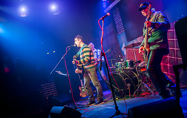 Image showing Band performs on stage in a nightclub