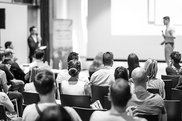 Image showing Business speaker giving a talk at business conference event.