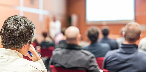 Image showing Audience in conference hall listening to presentation on business conference.