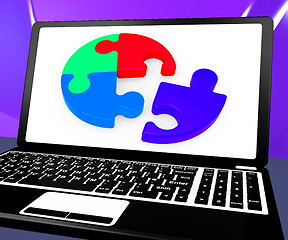 Image showing Unfinished Puzzle On Laptop Showing Teamwork