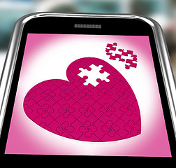 Image showing Puzzle Heart On Smartphone Showing Commitment