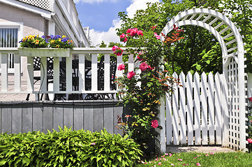 Image showing White arbor in a garden