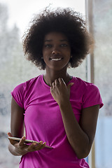 Image showing african american woman using tablet