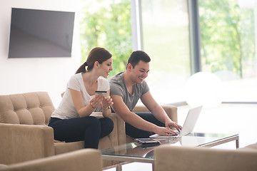 Image showing happy young couple buying online