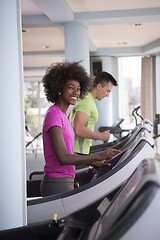 Image showing people exercisinng a cardio on treadmill in gym