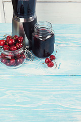 Image showing Cherry juice with glass of berries