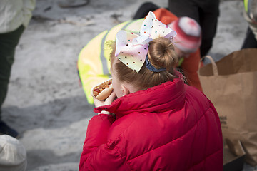 Image showing Girl eating Hot dog