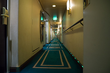 Image showing Passenger deck hallway with living cabins rooms on board of crui