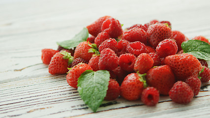 Image showing Leaves on heap of berries