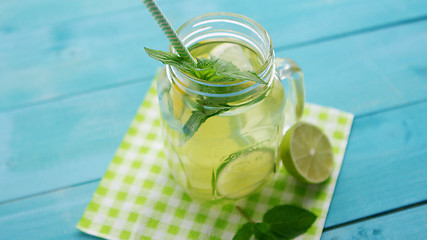 Image showing Glass with lime cocktail and straw