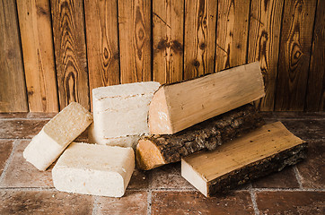 Image showing Wood briquette and firewood, close-up