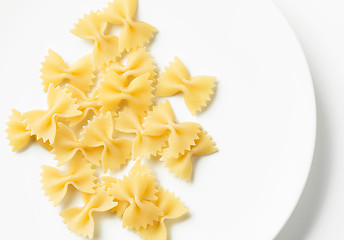 Image showing fresh pasta bows on white plate