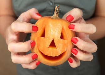 Image showing pumpkin in hands for Halloween