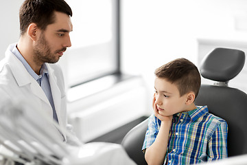 Image showing dentist with patient having toothache at clinic