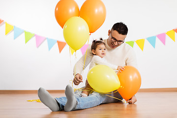 Image showing father and daughter with birthday party balloons