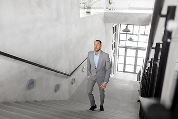 Image showing businessman walking upstairs