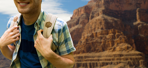 Image showing close up of man with backpack over grand canyon