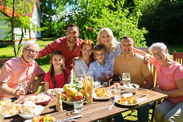 Image showing happy family having dinner or summer garden party