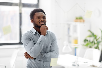 Image showing businessman looking at glass board at office