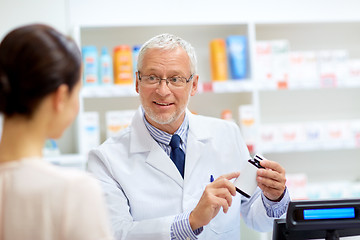 Image showing apothecary with cure and customer at pharmacy