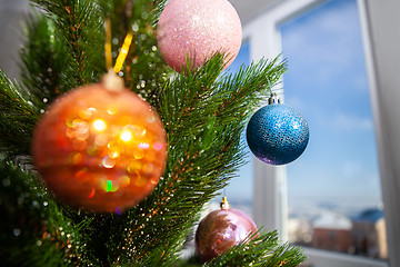 Image showing New Year tree near a window
