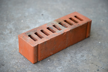 Image showing old brick on grey concrete background