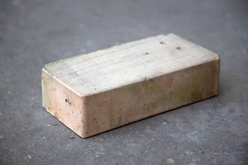 Image showing old brick on grey concrete background