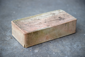 Image showing old brick on grey concrete background