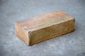 Image showing old brick on grey concrete background