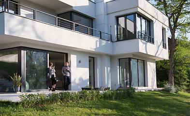 Image showing couple enjoying on the door of their luxury home villa