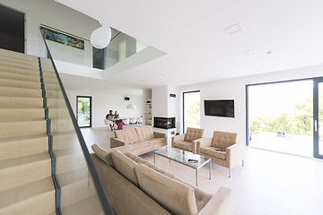 Image showing family with little girl enjoys in the modern living room