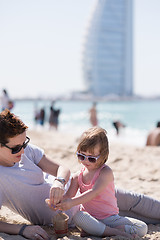 Image showing Mom and daughter on the beach