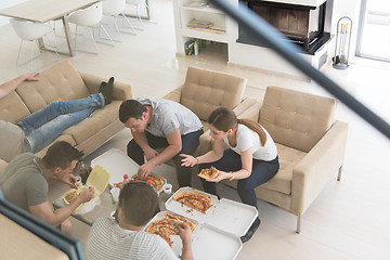 Image showing Pizza time a group of people