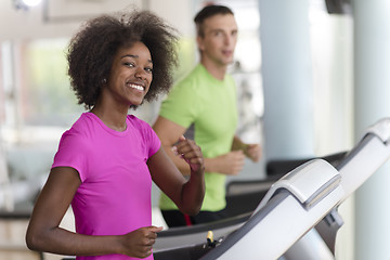 Image showing people exercisinng a cardio on treadmill