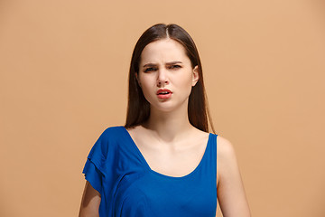 Image showing Disgust woman with thoughtful expression making choice against pastel background