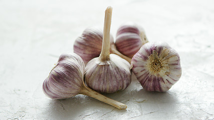 Image showing Heap of unpeeled garlic bulbs