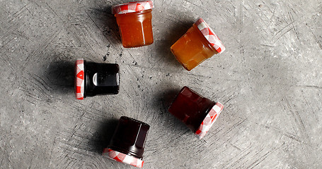 Image showing Small jars with various marmalade