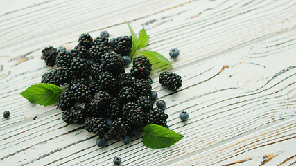 Image showing Heap of blackberry with mint leaves