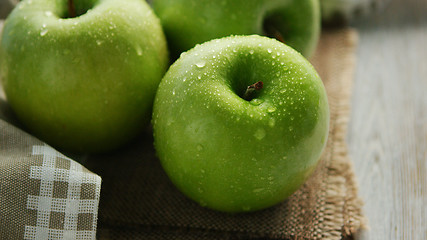 Image showing Green wet apples in drops