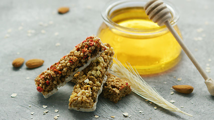 Image showing Jar of honey and oat bars