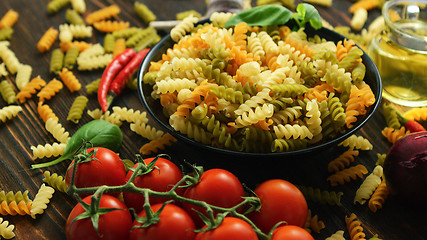 Image showing Bowl with raw macaroni of different color