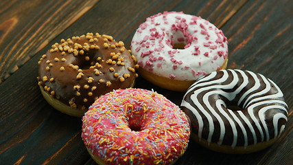 Image showing Sweet donuts with different glazing 