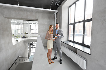 Image showing businesswoman and businessman with smartphone