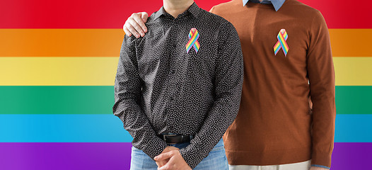 Image showing close up of couple with gay pride rainbow ribbons