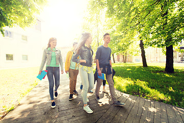 Image showing group of happy teenage students walking outdoors