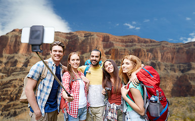 Image showing happy travelers taking selfie at grand canyon