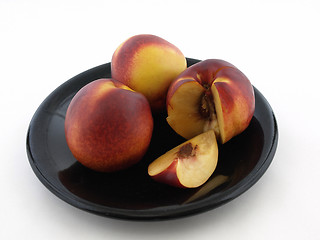 Image showing Peaches on Black Plate