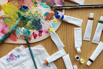 Image showing palette, brushes and paint tubes on table